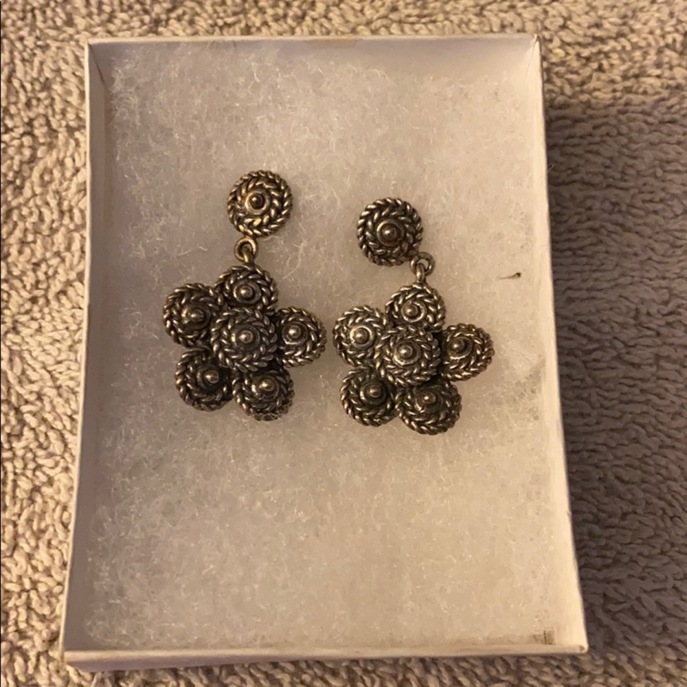 Silver earrings.